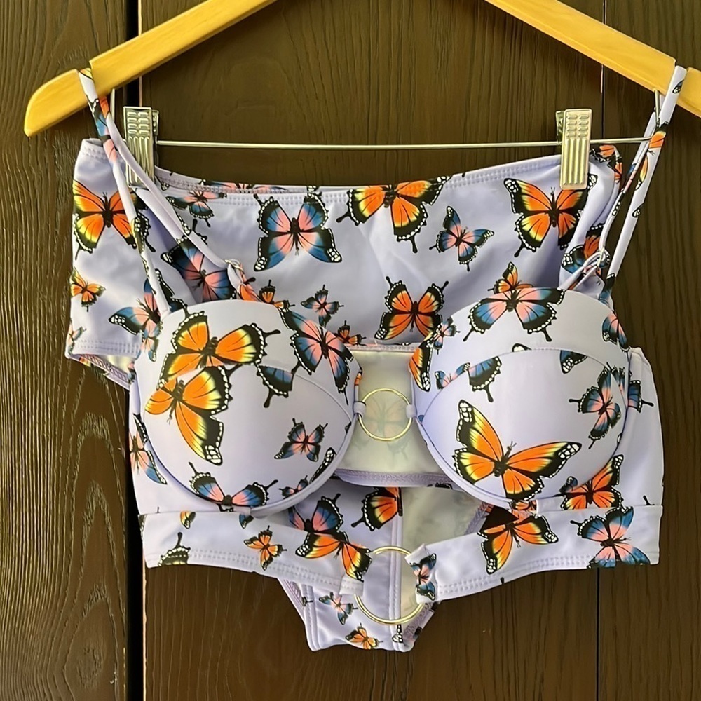 Bikini purple with butterflies. Size Large. Never worn. NWOT